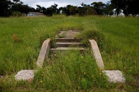 Stairs where a house once stood are pictured as Tropical Storm Gordon approaches Waveland, Mississippi, U.S., September 4, 2018. REUTERS/Jonathan Bachman