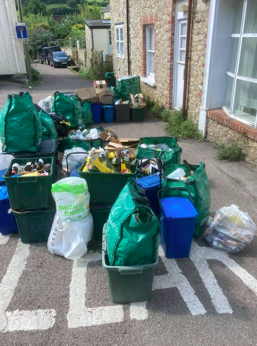 Piles of rubbish have gone uncollected after the car blocked access to binmen. (SWNS)