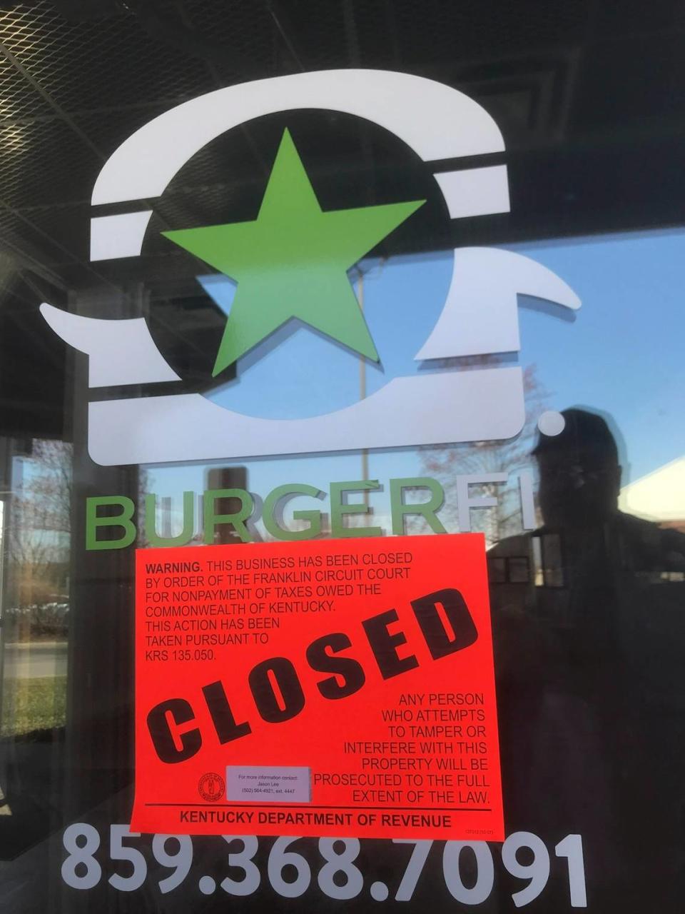 The BurgerFi location in Hamburg has signs on the door that say “This Business Has Been Closed By Order of the Franklin Circuit Court for Nonpayment of Taxes Owed the Commonwealth of Kentucky.” An eviction notice is also taped to the door.