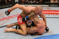 LAS VEGAS - JULY 11: Georges St-Pierre (red tight shorts) def. Thiago Alves (black Brazil flag shorts) - Unanimous Decision during UFC 100 at Mandalay Bay Events Center on July 11, 2009 in Las Vegas, Nevada. (Photo by Josh Hedges/Zuffa LLC via Getty Images)