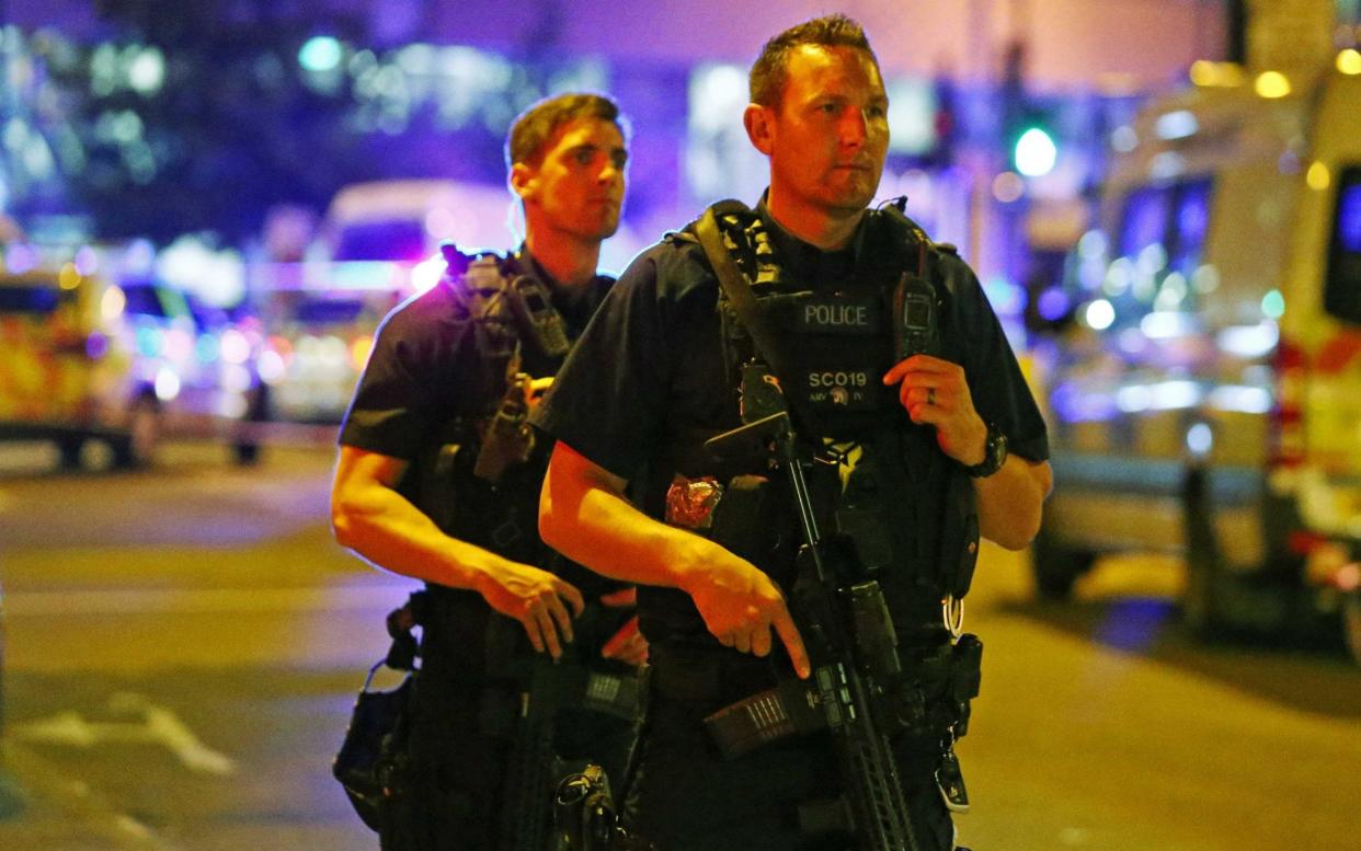 Police officers attend to the scene after a vehicle collided with pedestrians in the Finsbury Park neighborhood of North London - REUTERS