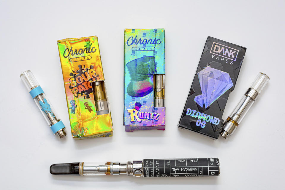 This photo made available by the New York State Department of Health on Sept. 5, 2019 shows a few of the cannabis-containing vaping products which contained high levels of vitamin E acetate. Vitamin E acetate is a key focus of the department's investigation of potential causes of vaping-associated pulmonary illnesses. (Mike Wren/New York State Department of Health via AP)