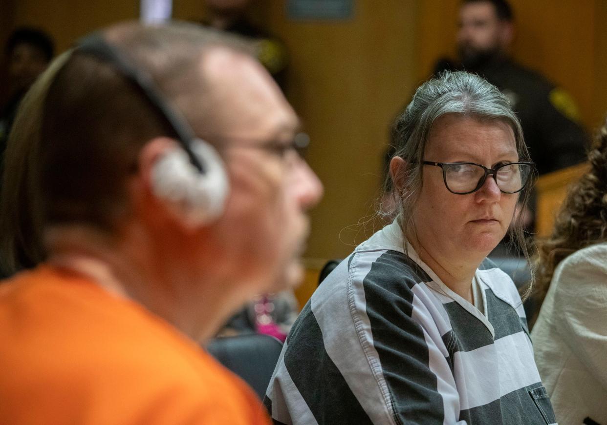PONTIAC, MICHIGAN - APRIL 9: Jennifer Crumbley looks at her husband James Crumbley during their sentencing on four counts of involuntary manslaughter for the deaths of four Oxford High School students by their son, mass school shooter Ethan Crumbley, on April 9, 2024 at Oakland County Circuit Court in Pontiac, Michigan. Jennifer and James Crumbley are the first parents in U.S. history to be criminally tried and convicted for a mass school shooting that was committed by their child.