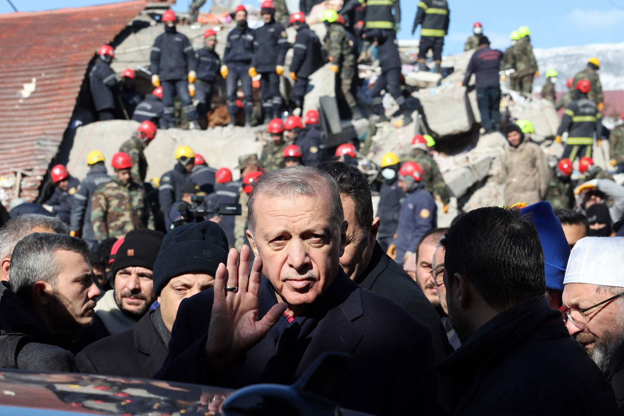 Turkish President Recep Tayyip Erdogan tours the site of destroyed buildings during his visit to the city of Kahramanmaras in southeast Turkey, two days after the severe earthquake that hit the region on Feb. 8, 2023.