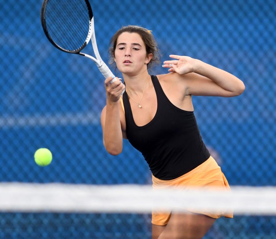 Hoover's Tess Bucher returns the ball against Lake's Hannah Neely, Wednesday, Aug. 30, 2023.