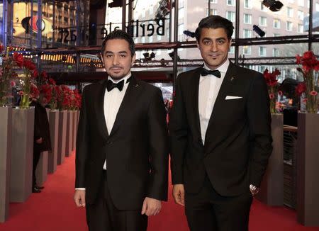 Actors Sherwan Haji (L) and Simon Hussein Al-Bazoon arrive for the screening of the movie 'The Other Side of Hope' at the 67th Berlinale International Film Festival in Berlin, February 14, 2017. REUTERS/Axel Schmidt