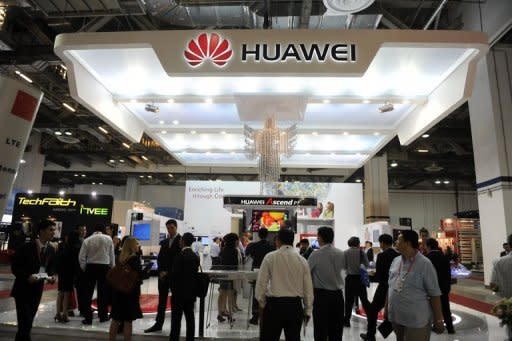 Visitors gather at the Huawei booth during the CommunicAsia telecom expo and conference in Singapore in June 2012. Hackers at an infamous Def Con gathering were shown how to easily slip into computer networks through some routers made by Chinese electronics colossus Huawei Technologies