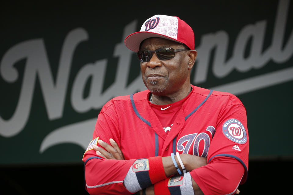 FILE- In this July 4, 2016, file photo, Washington Nationals manager Dusty Baker (12) stands in the dugout before a baseball game against the Milwaukee Brewers at Nationals Park in Washington. A person with knowledge of the negotiations said Tuesday, Jan. 28,2 020, that Baker, 70, is working to finalize an agreement to become manager of the Houston Astros. The person spoke on condition of anonymity because the deal has not yet been completed. (AP Photo/Alex Brandon, File)