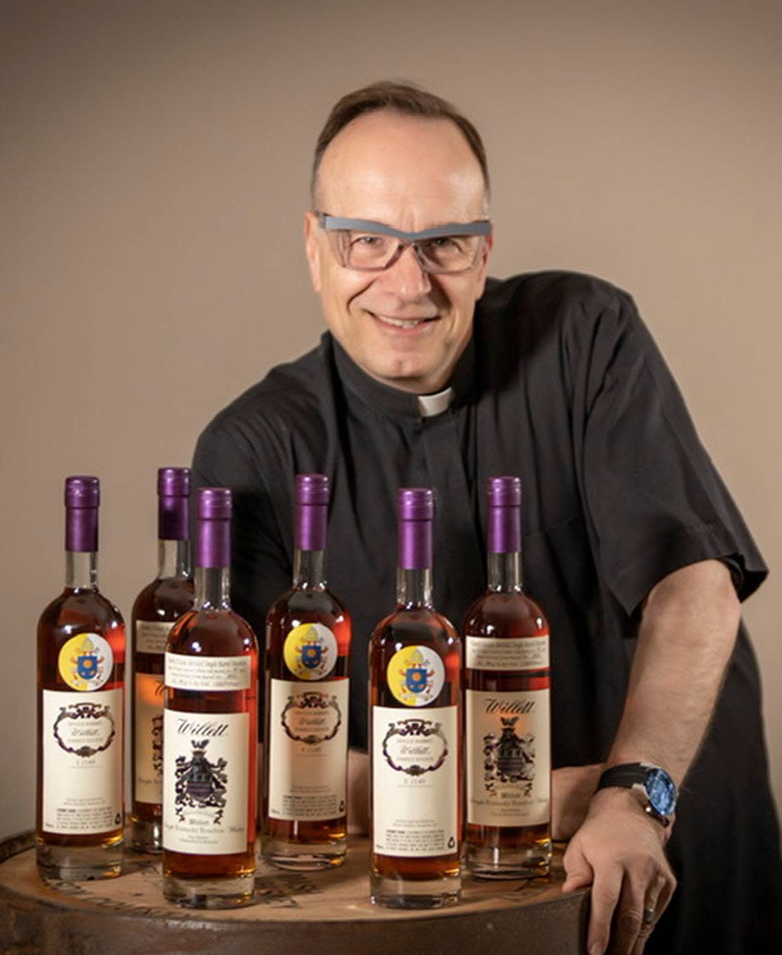 Father Jim Sichko with his Willett bourbon.