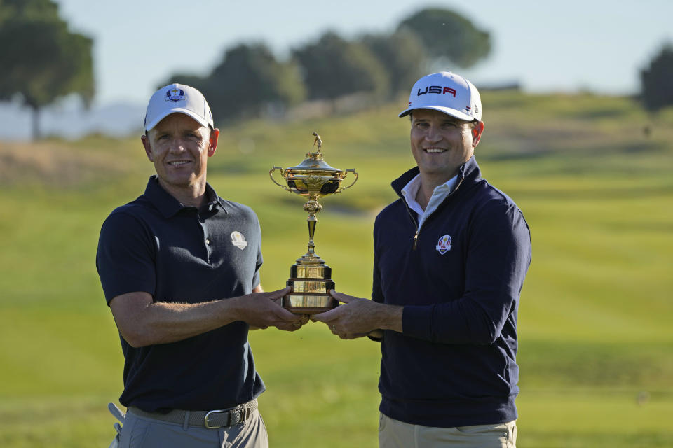 European Captain Luke Donald, left, and United States Captain Zach Johnson pose with the Ryder Cup trophy before an exhibition match on the occasion of The Year to Go event at the Marco Simone course that will host the 2023 Ryder Cup, in Guidonia Montecelio, near Rome, Italy, Monday, Oct. 3, 2022. (AP Photo/Alessandra Tarantino)