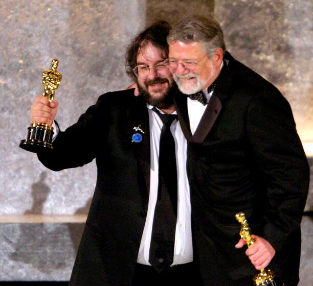 Director Peter Jackson, left, and producer Barrie M. Osborne accept the award for best picture for "Lord of the Rings: Return of the King" at the 76th Annual Academy Awards show in Los Angeles Sunday, Feb. 29, 2004. (AP Photo/Mark J. Terrill)