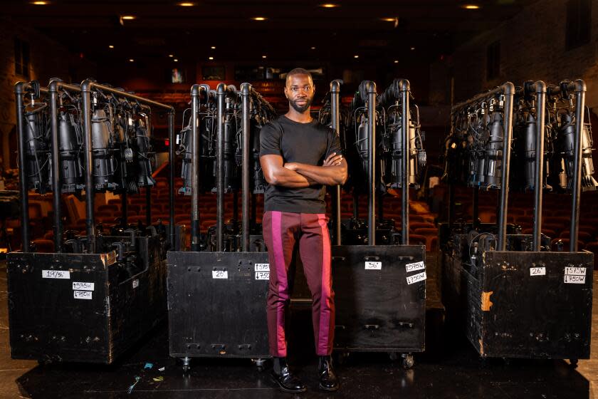 Los Angeles, CA - September 01: Playwright and Oscar-winning screenwriter Tarell Alvin McCraney is the new artistic director of Geffen Playhouse, and is photographed on the stage at the Los Angeles, CA, playhouse, Friday, Sept. 1, 2023. (Jay L. Clendenin / Los Angeles Times)