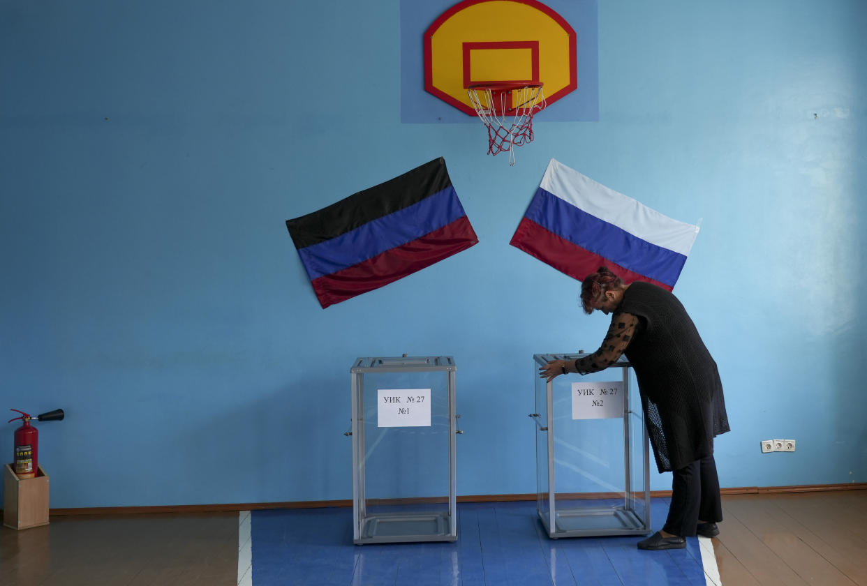 A woman casts her vote in Donetsk, Ukraine.