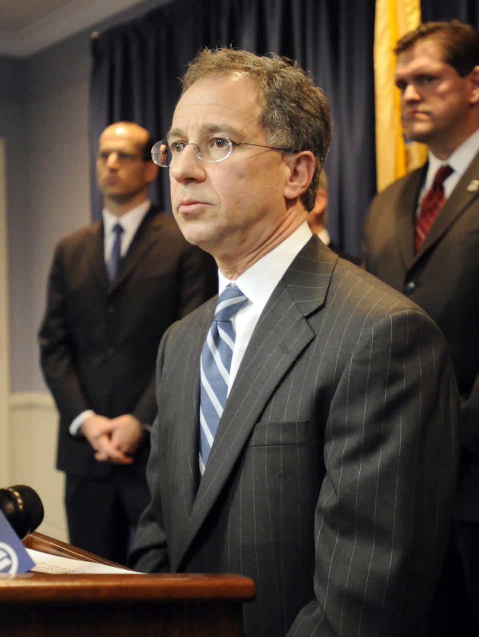 U.S. Attorney Paul J.Fishman listens to a question at a news conference announcing the uncovering of one of the largest counterfeit goods smuggling operations ever charged Friday, March 2, 2012, in Newark, N.J. (AP Photo/Bill Kostroun)