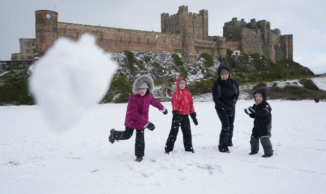 A family have a snowball fight