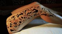 We know it's a tattoo but this lady's leg looks exactly like a wooden carving.