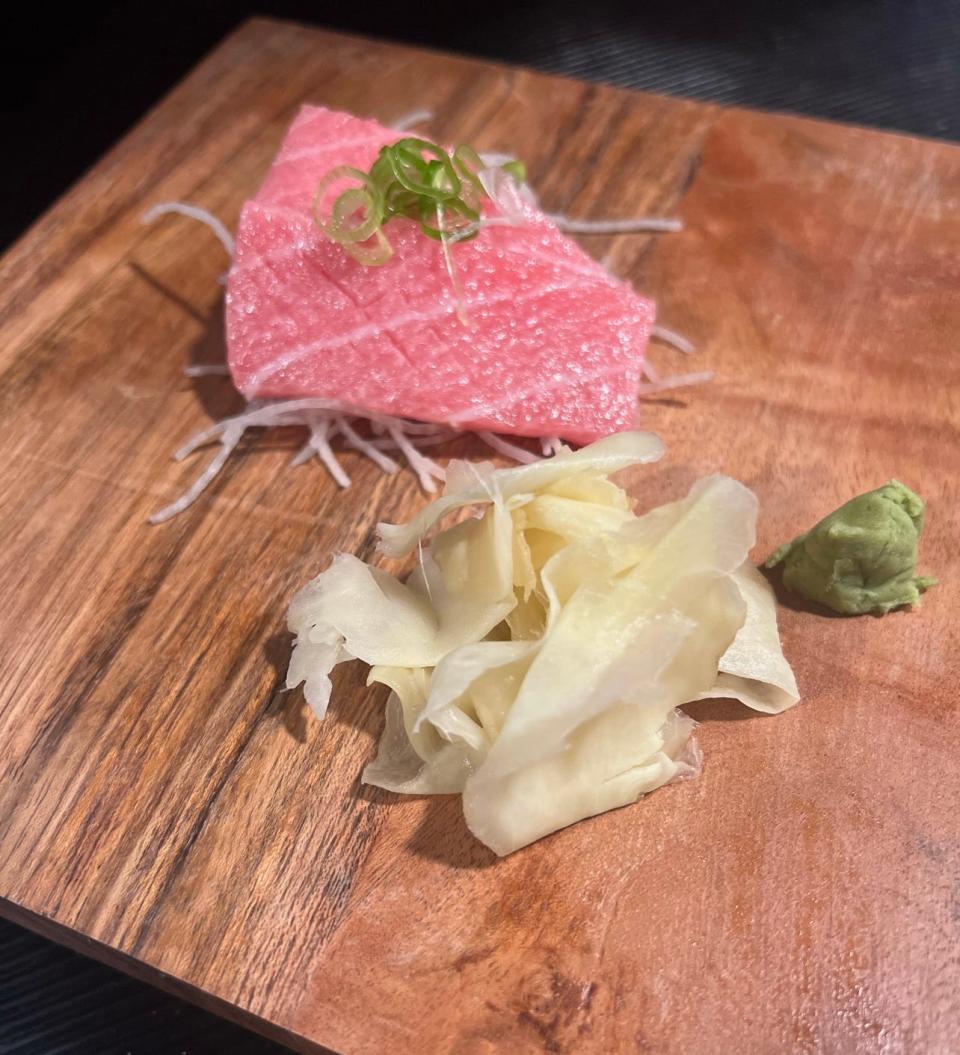 Toro aka tuna sashimi presented on a wooden board at Safu Sushi in Toms River.