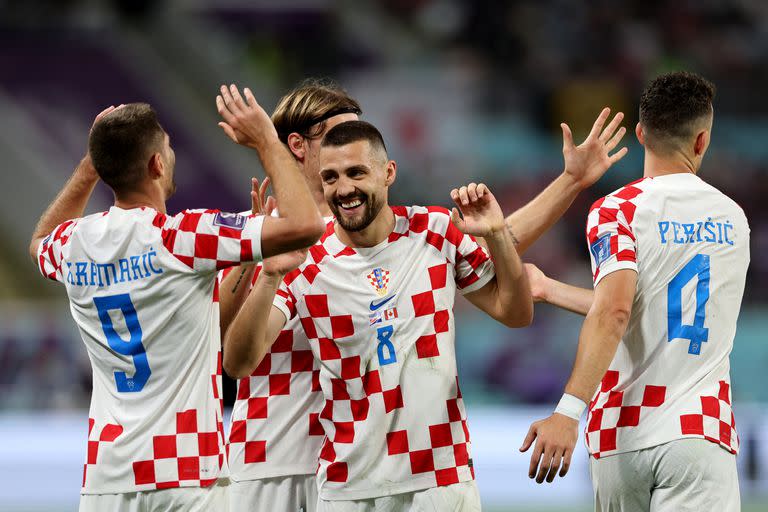 Croatia's forward #09 Andrej Kramaric celebrates after scoring his team's third goal during the Qatar 2022 World Cup Group F football match between Croatia and Canada at the Khalifa International Stadium in Doha on November 27, 2022. (Photo by Adrian DENNIS / AFP)