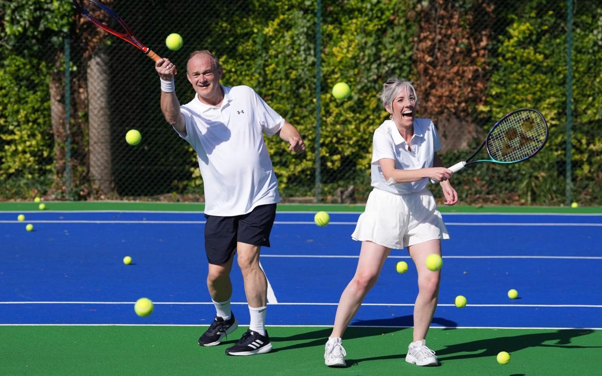 Sir Ed Davey playing tennis with Lib Dem deputy leader Daisy Cooper at St Ann's Tennis Courts in Brighton