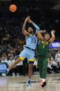 Marquette's David Joplin and Baylor's Keyonte George go after a loose ball during the first half of an NCAA basketball game Tuesday, Nov. 29, 2022, in Milwaukee. (AP Photo/Morry Gash)