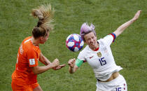 Netherlands' Desiree Van Lunteren, left, and United States' Megan Rapinoe challenge for the ball during the Women's World Cup final soccer match between US and The Netherlands at the Stade de Lyon in Decines, outside Lyon, France, Sunday, July 7, 2019. (AP Photo/Francois Mori)