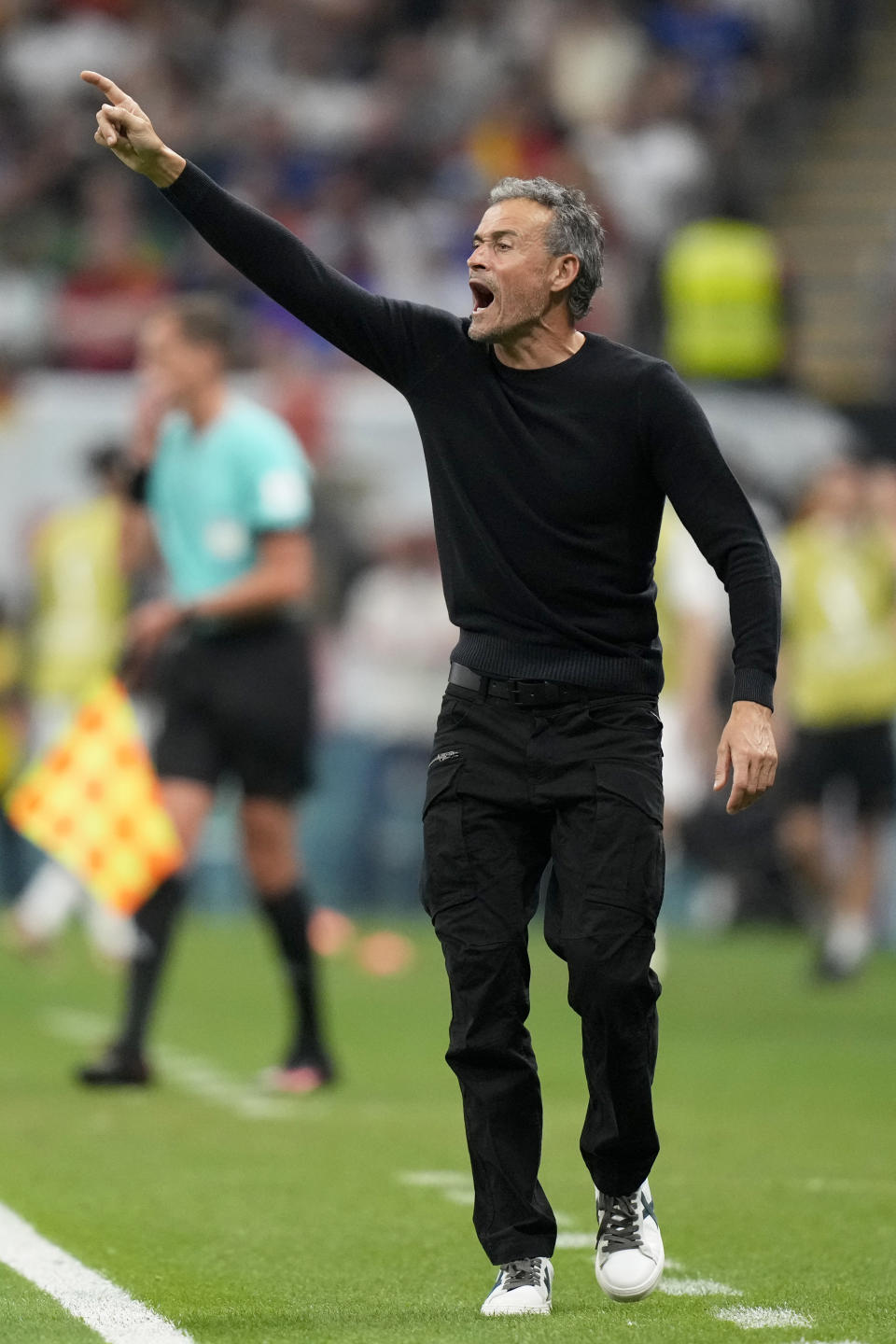 Spain's head coach Luis Enrique gestures during the World Cup group E soccer match between Spain and Germany, at the Al Bayt Stadium in Al Khor , Qatar, Sunday, Nov. 27, 2022. (AP Photo/Matthias Schrader)