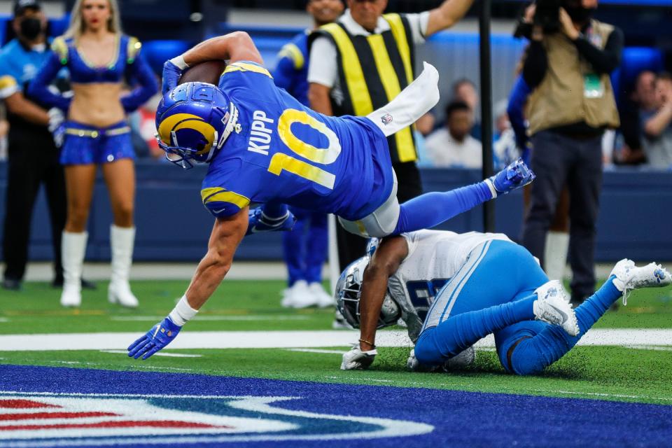 Los Angeles Rams wide receiver Cooper Kupp (10) jumps over Detroit Lions cornerback Daryl Worley (33) for a touchdown during the second half at the SoFi Stadium in Inglewood, Calif. on Sunday, Oct. 24, 2021.