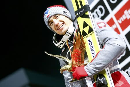 Ski Jumping - 65th four-hills ski jumping tournament final round - Bischofshofen, Austria - 06/01/2017 - Poland's Kamil Stoch celebrates after winning the 65th four-hills tournament. REUTERS/Dominic Ebenbichler