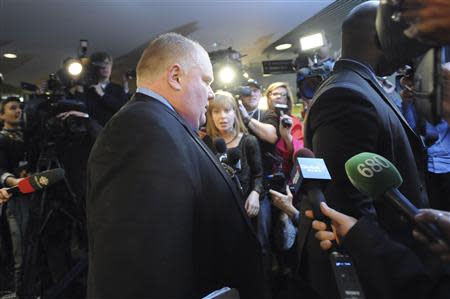 Toronto Mayor Rob Ford leaves his City Hall office to return to a city council meeting after a lunch break in Toronto November 15, 2013. REUTERS/Jon Blacker