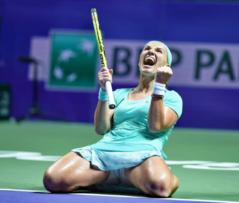 Russia's Svetlana Kuznetsova celebrates after winning against Karolina Pliskova of the Czech Republic at the WTA Finals tennis tournament on October 26, 2016 in Singapore