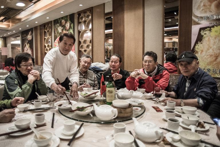 Veteran military personnel have lunch together in Hong Kong