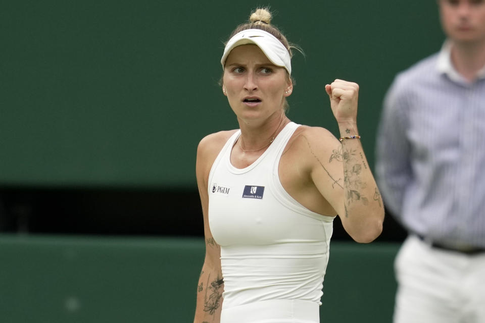Czech Republic's Marketa Vondrousova in action against Ukraine's Elina Svitolina during the women's semifinal singles match on day eleven of the Wimbledon tennis championships in London, Thursday, July 13, 2023. (AP Photo/Kin Cheung)