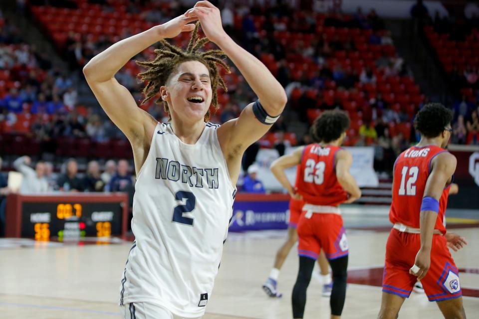 Edmond North's TO Barrett celebrates after beating Moore in the Class 6A boys basketball state championship game on March 12 at the Lloyd Noble Center in Norman.