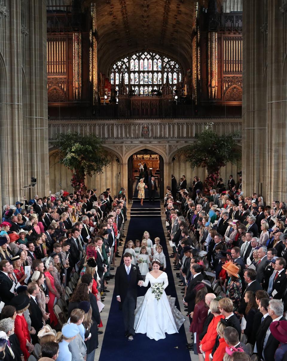 Princess Eugenie of York and Mr. Jack Brooksbank walk down the aisle after they were married at St. George's Chapel on October 12, 2018 in Windsor, England