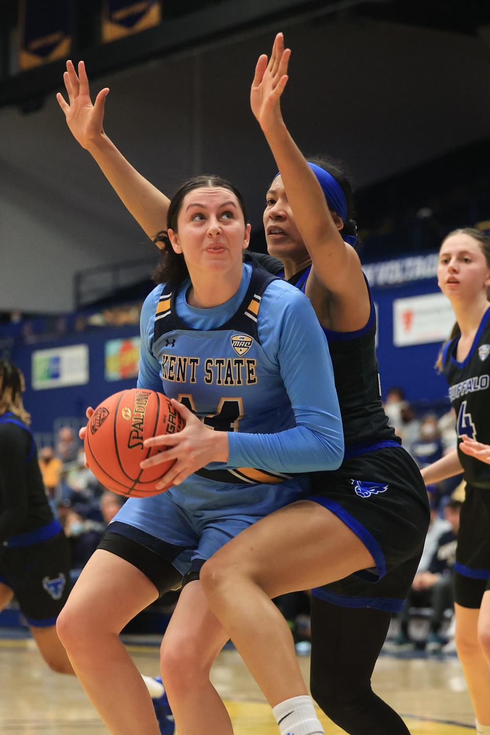 Kent State junior guard Katie Shumate drives to the basket around Buffalo grad student forward Summer Hemphill during Saturday afternoon's game at the Kent State M.A.C. Center.