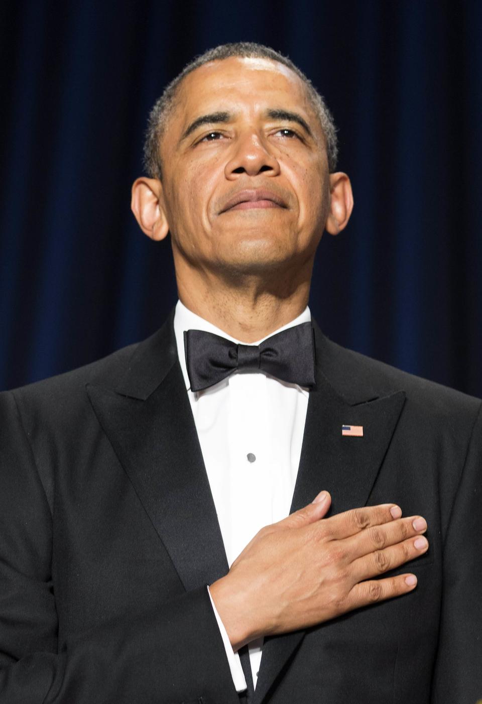 U.S. President Barack Obama stands during the posting of colors at the White House Correspondents' Association Dinner in Washington May 3, 2014. (REUTERS/Joshua Roberts)