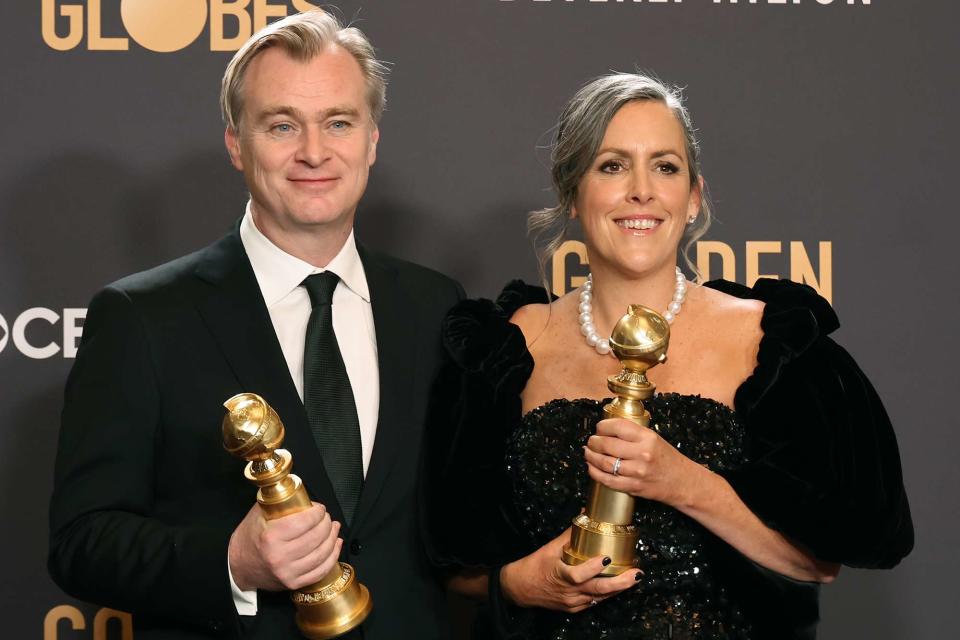 <p>Amy Sussman/Getty</p> Christopher Nolan and Emma Thomas pose in the press room during the 81st Annual Golden Globe Awards on January 07, 2024.