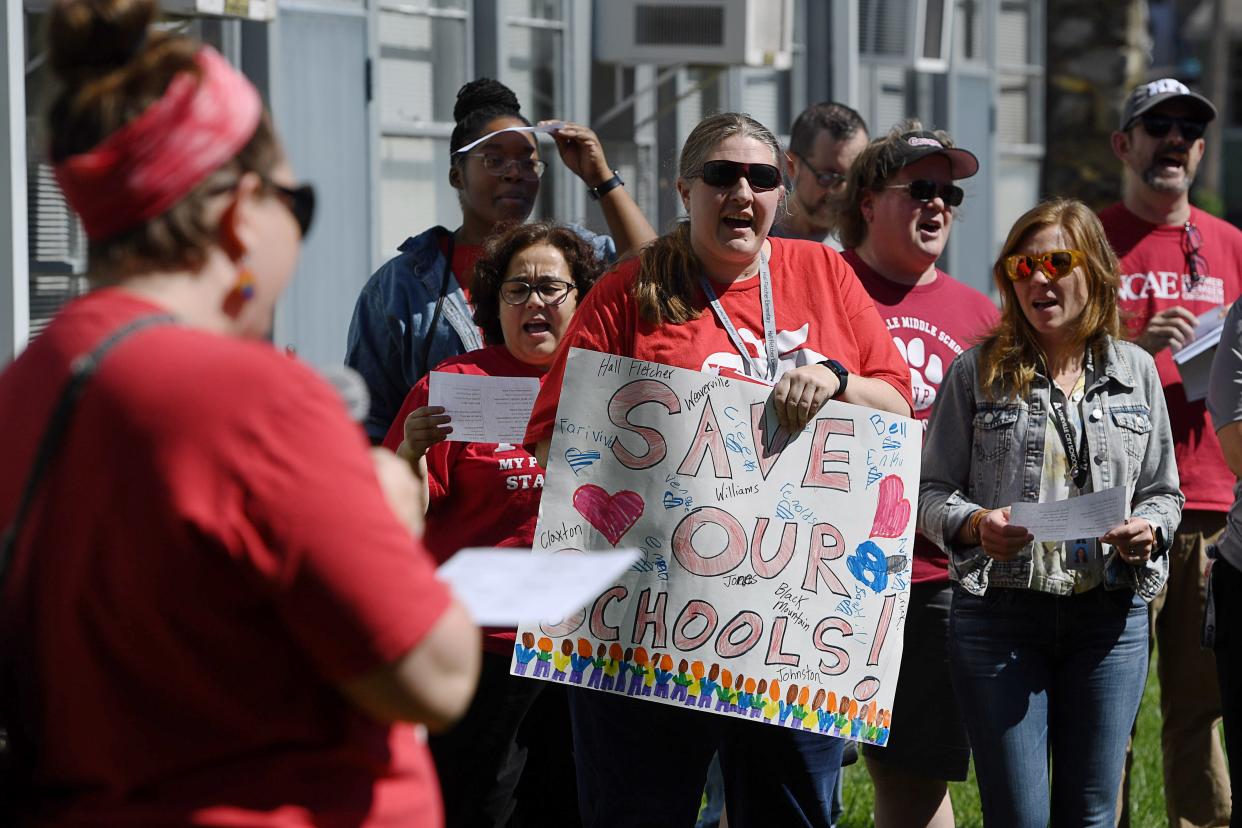 Asheville City Schools teachers held a rally before the school board meeting in Asheville, June 10, 2024.