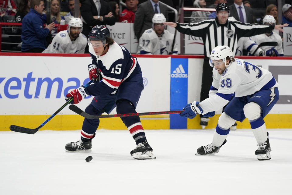 Washington Capitals left wing Sonny Milano, left, skates past Tampa Bay Lightning left wing Brandon Hagel in the third period of an NHL hockey game, Friday, Nov. 11, 2022, in Washington. (AP Photo/Patrick Semansky)