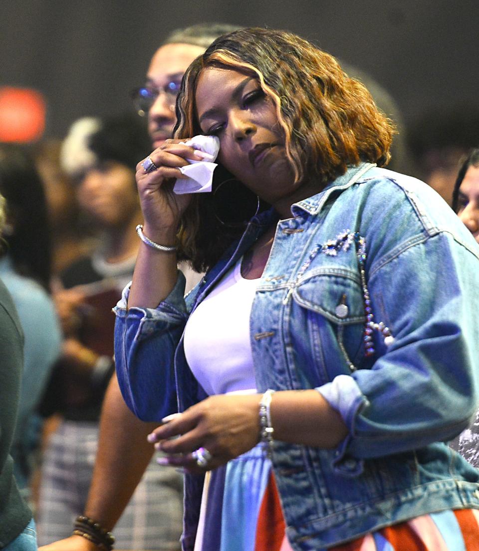 Aventer Gray, wife of Pastor John Gray, reacts as he takes the stage during the Sunday morning service at Relentless Church in Greenville.