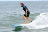 <p>Gerard Butler spends his Sunday surfing off the coast of Malibu.</p>