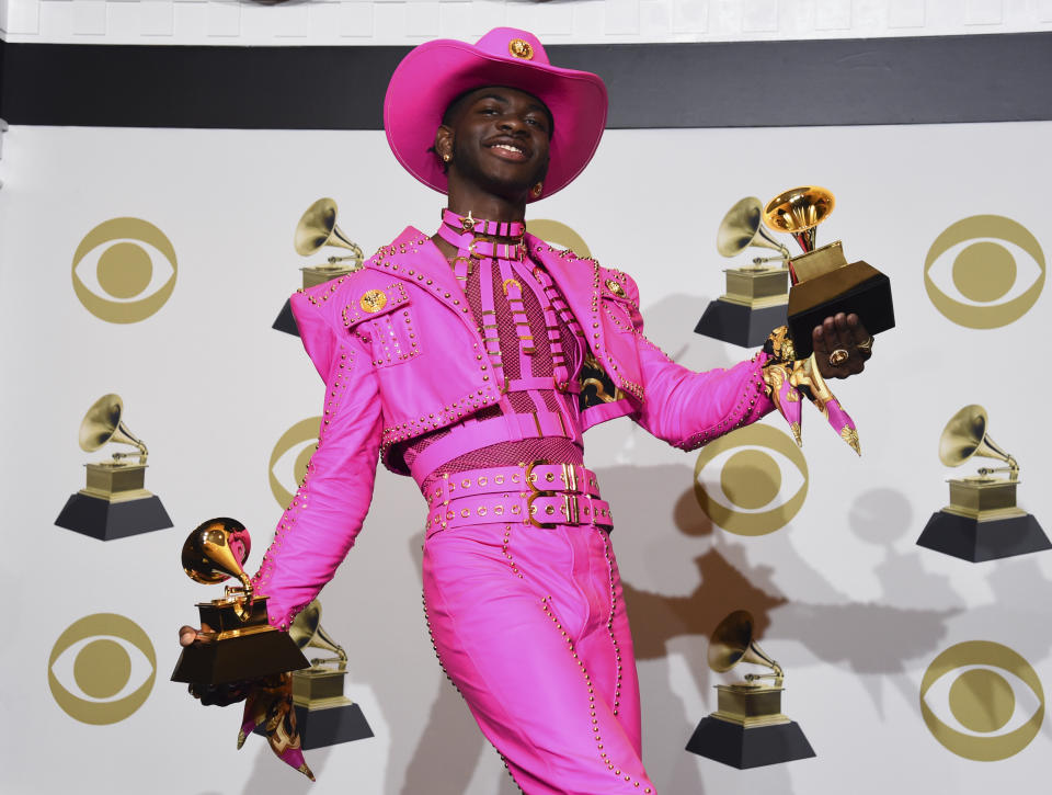 FILE - In this Jan. 26, 2020 file photo, Lil Nas X poses in the press room with the awards for best music video and best pop duo/group performance for "Old Town Road," at the 62nd annual Grammy Awards in Los Angeles. (AP Photo/Chris Pizzello, File)