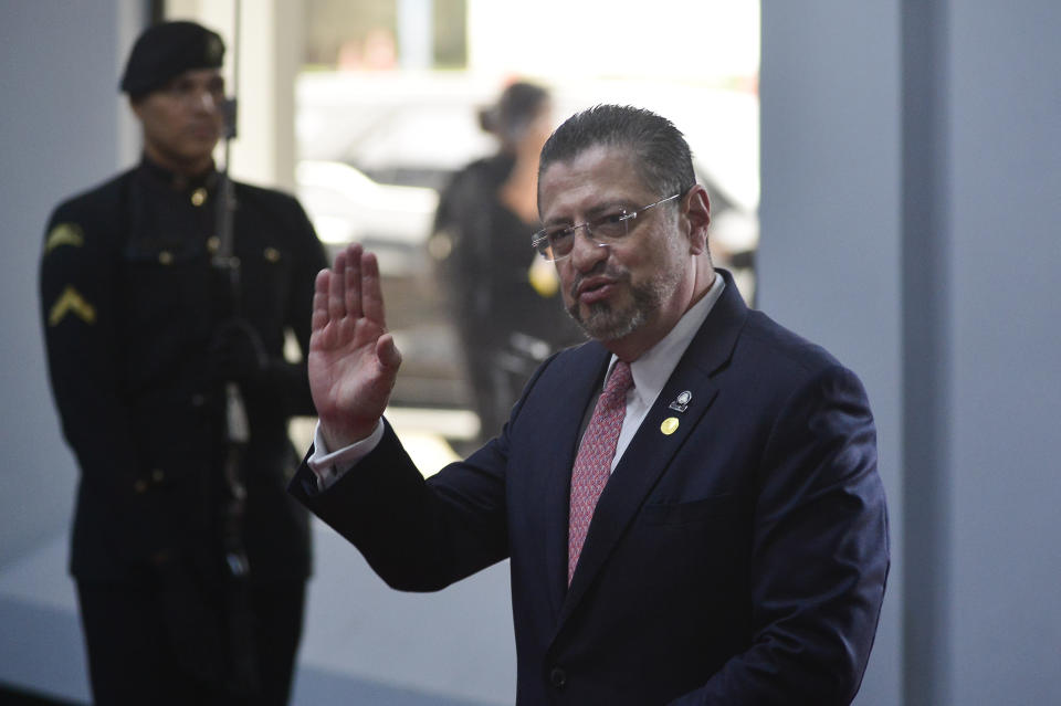 Costa Rica's President Rodrigo Chaves Robles waves to the press as he arrives at the swearing-in ceremony of Panama's President-elect Jose Raul Mulino at the Atlapa Convention Centre in Panama City, Monday, July 1, 2024. (AP Photo/Agustin Herrera)