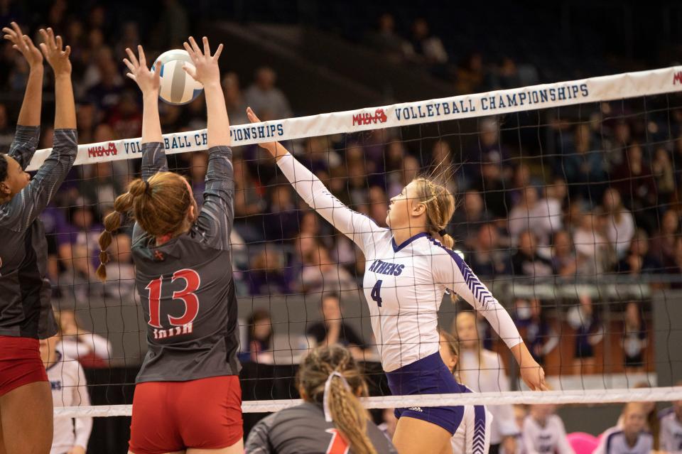 Athens player Kamryn Parlin hits the ball during the Division 4 State Final match at Kellogg Arena on Saturday, Nov. 19, 2022.