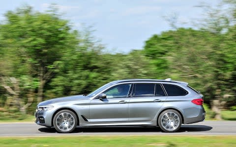 2017 BMW 5-series Touring driving, side 