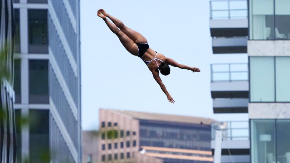 Morgane Herculano, of Switzerland, competes at the Cliff Diving World Series on Boston Harbor, Friday, June 7, 2024, in Boston. (AP Photo/Charles Krupa)
