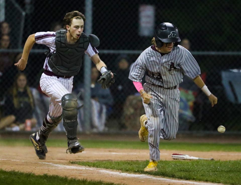 Appoquinimink's Haiden Smith races for first but can't beat the throw from Caravel catcher Miguel Herb in the sixth inning of the Bucs' 7-3 home win Wednesday, May 17, 2023. 