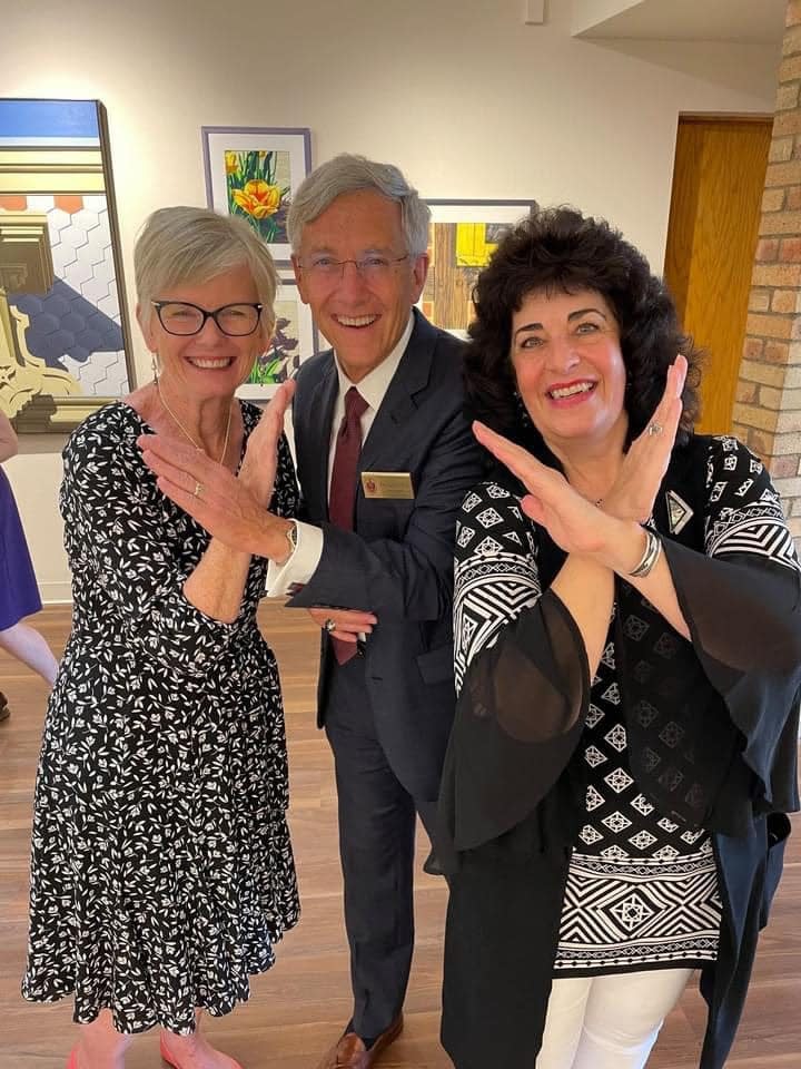 Diane Belfiglio, right, is shown with fellow staff and administrators at Walsh University, including Walsh President Dr. Tim Collins. Belfiglio, an assistant art professor, also was a longtime artist, exhibiting her paintings at galleries and museums both locally and outside the area.