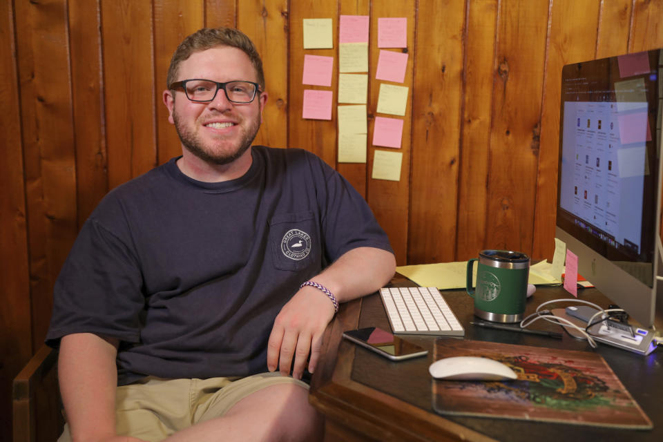 This July 6, 2020 photo provided by Jared Saigh shows him at home in Iron River, Mich. When the coronavirus pandemic struck, an offer for Saigh's dream job was rescinded. “I’ve learned that you can’t possibly plan for everything and though it’s a cliche, you’ve just got to roll with the punches,” he says. “And I’ve learned to go where the next thing leads me. Hopefully, that will be soon.” (Jared Saigh via AP)