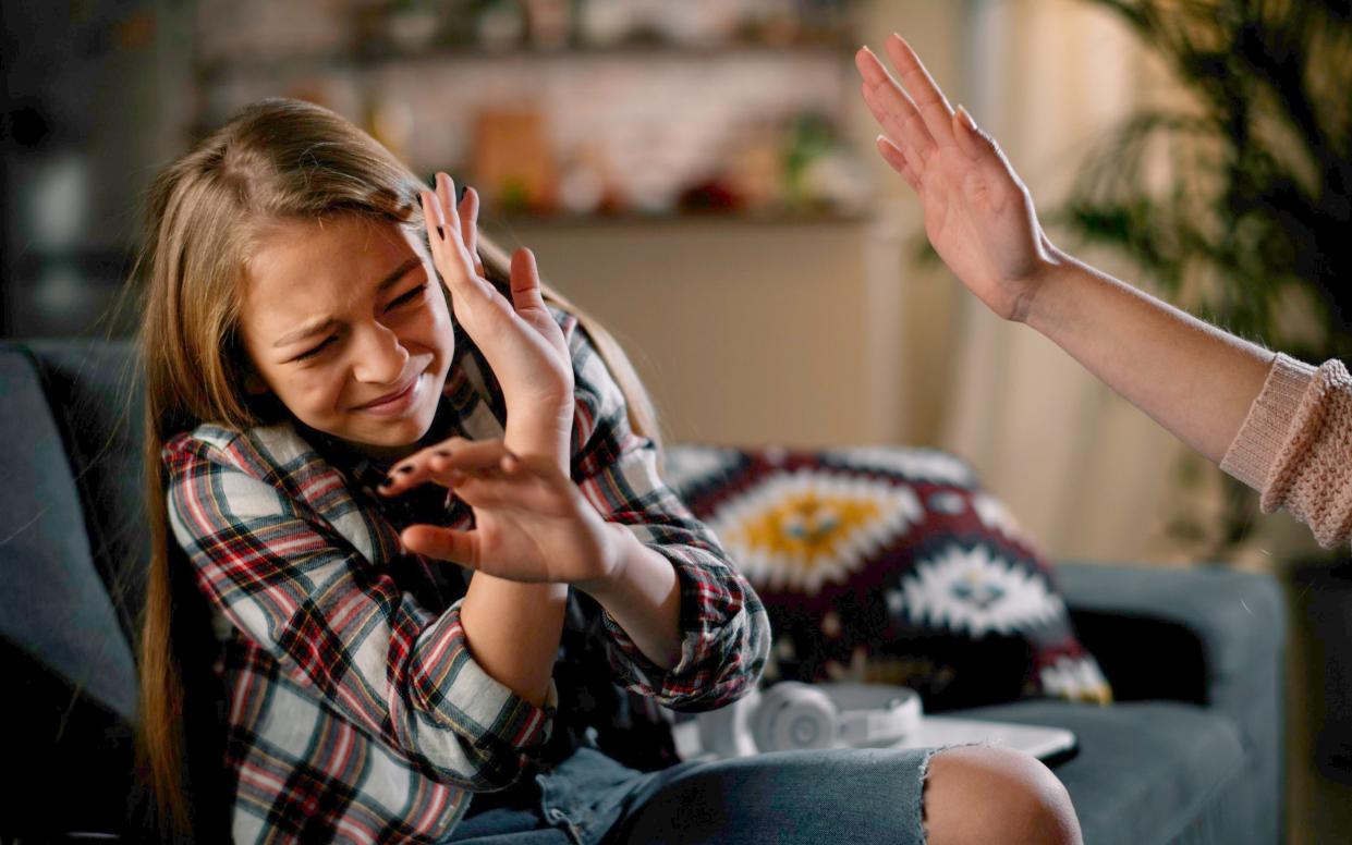 An image of a child facing being slapped